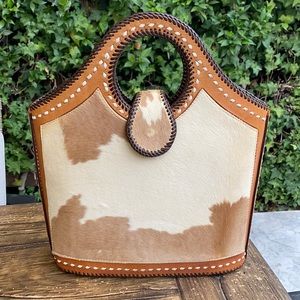 One of a kind handmade cow hide leather hand tote.